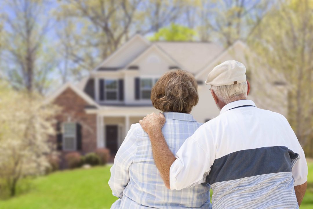 Older couple looking at a home